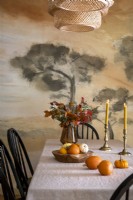 Autumnal display on vintage style dining table
