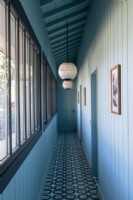 View down blue hallway