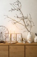 Bare branches decorated with fairy lights for Christmas