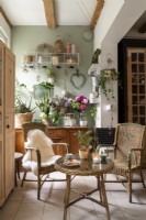 Flowers and vintage furniture in country living room