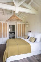 Country bedroom with vaulted ceiling and ensuite bathroom