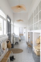 White and pale grey hallway of converted school