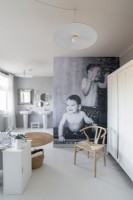 Photograph feature wall in modern white and grey bathroom