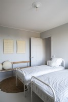 Twin beds in minimal childrens bedroom