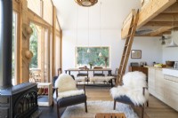 Sheepskin rugs on chairs in modern open plan living space
