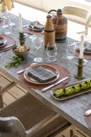 Detail of outdoor dining table laid for lunch
