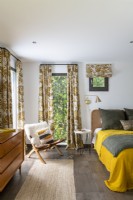Patterned vintage fabric curtains in modern bedroom