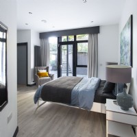 Modern bedroom with view through patio doors