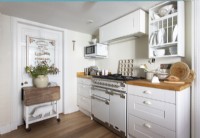 White and wooden country kitchen with range cooker