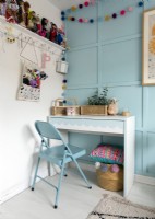Desk and blue chair in childrens room
