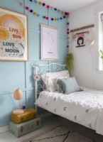 Blue painted panelled wall in modern childrens room