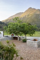 Outdoor kitchen with pizza oven and fire pit