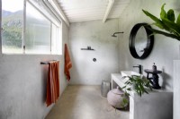 Minimalist bathroom with screed walls and floor