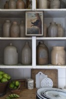Detail of rustic pots on shelves