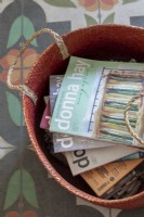 Collection of magazines in basket - detail