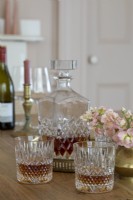 Detail of classic decanter and glasses on dining table