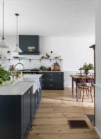 Country kitchen-diner with stripped wooden floors