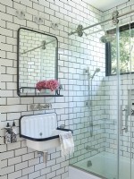 Black and white tiled guest bathroom with sink and shower