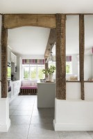 View into country kitchen through exposed wooden beams