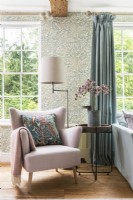 Pink armchair in country living room