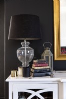 Table lamp and books on server