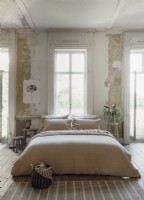 Oatmeal French bedlinen on double bed in front of French doors