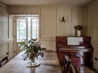Dining room with piano and French doors