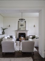 Drawing room with seating and fireplace