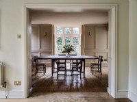 Neutral dining room with panelled walls