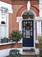 Front door with covered brick arch porch 