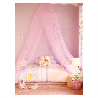 GAP Interiors - Modern girls bedroom with canopy and soft toys on bed ...