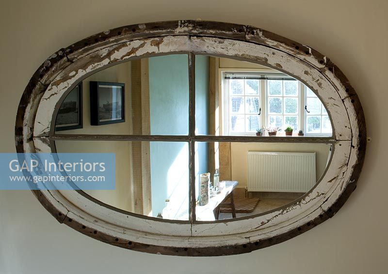 Boonshill Farm, East Sussex. Mirror showing reflection of bathroom.  
