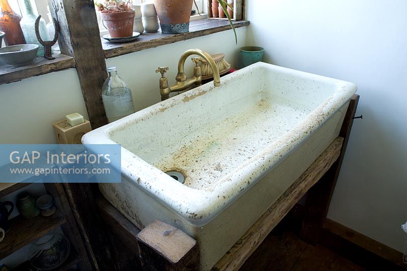 boonshill farm, east sussex. interior of pantry with old sink found in garden with reclaimed wooden stand made by mick shaw. 