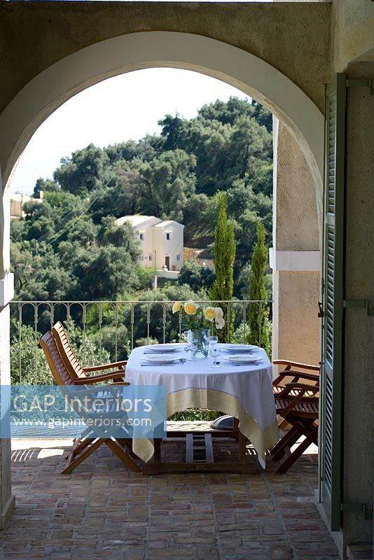Corfu, Greece. Yialiskari House Villa near Kalami. Terrace with table and chairs
