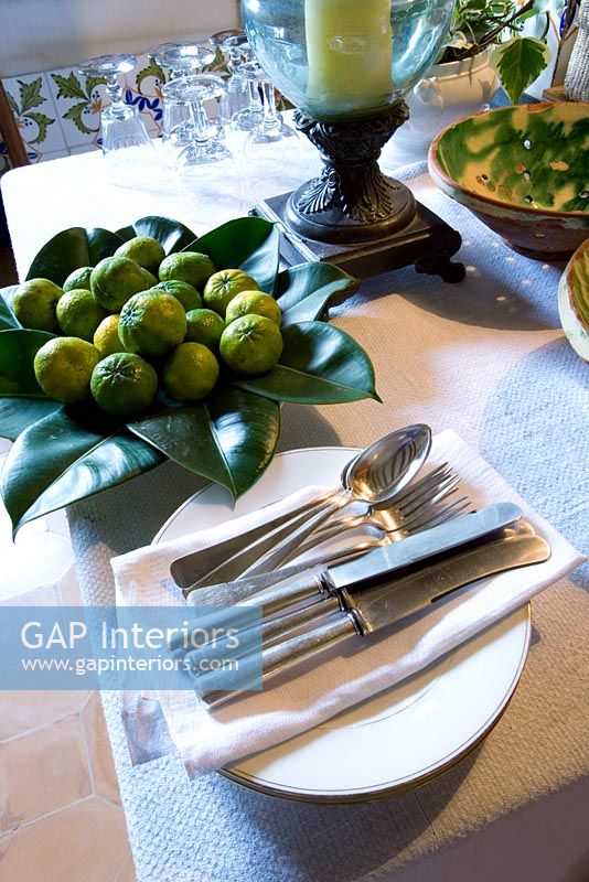 Detail of dining table showing place setting