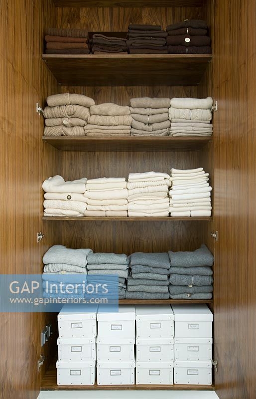 Tidy wardrobe showing sweaters from Tania Laurie latest collection