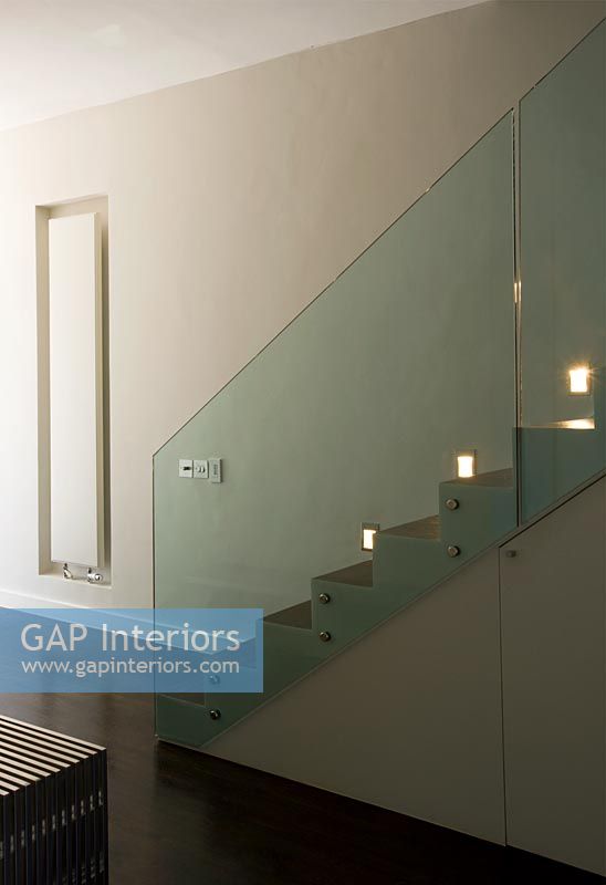 Contemporary hallway with stylish staircase with built in lighting