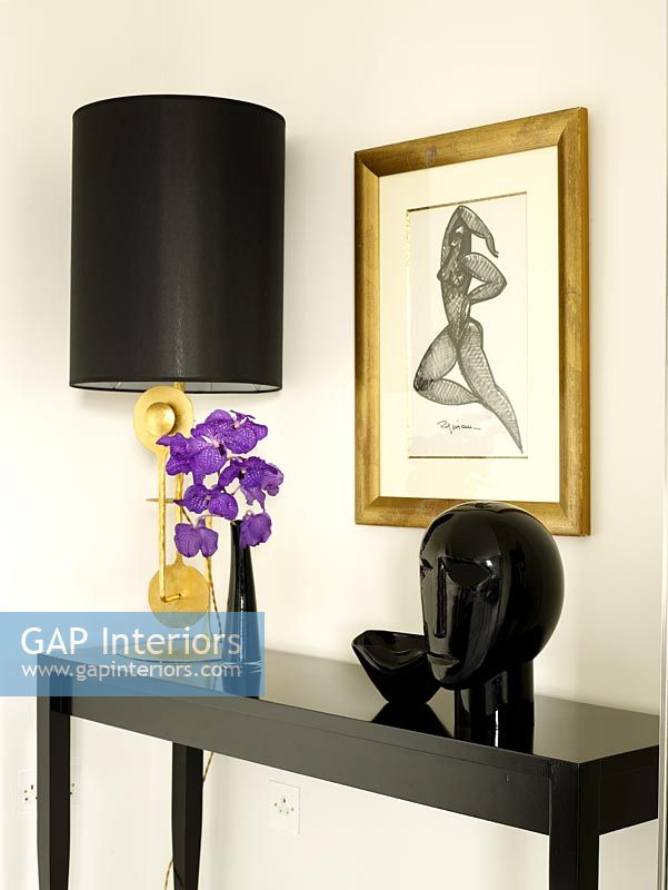 Dark wood console table with lamp