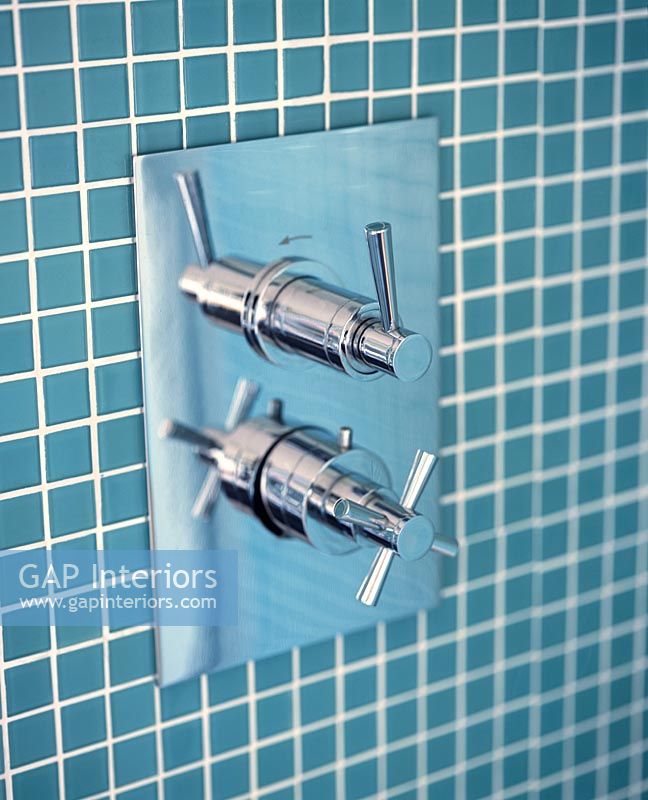 Detail of modern wall mounted shower fittings 