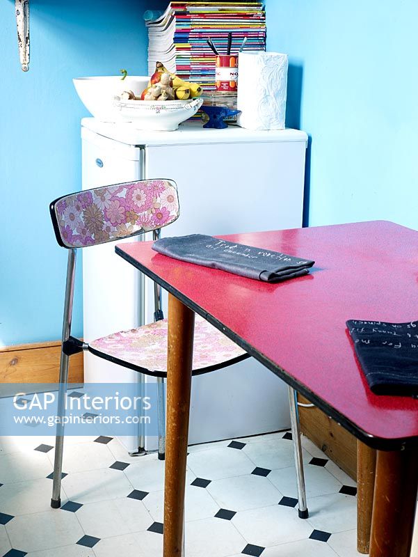 Detail of table and chairs in quirky kitchen