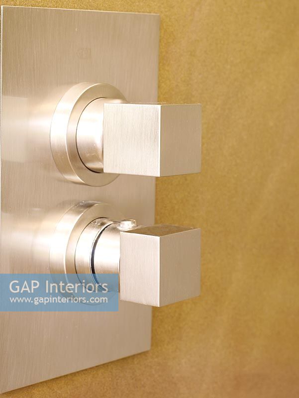Detail of contemporary  wall mounted shower controls 