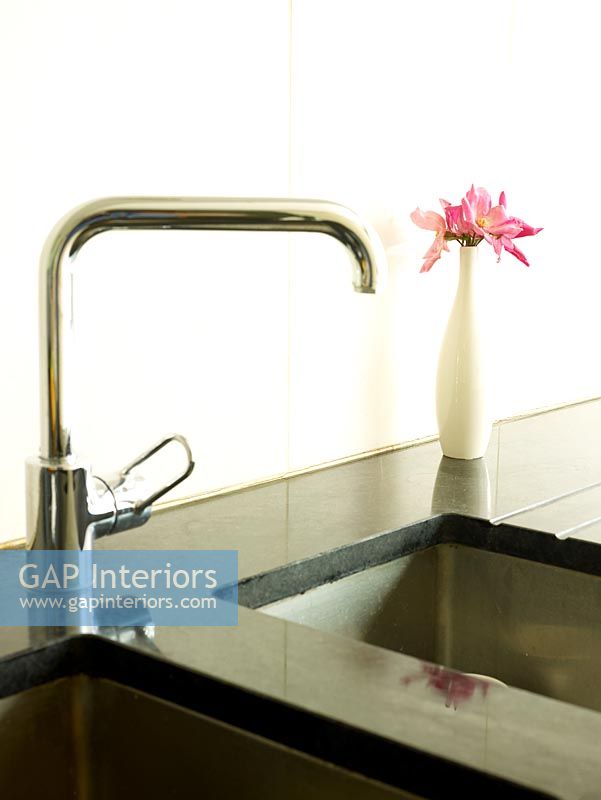 Detail of kitchen sink and corian worktop