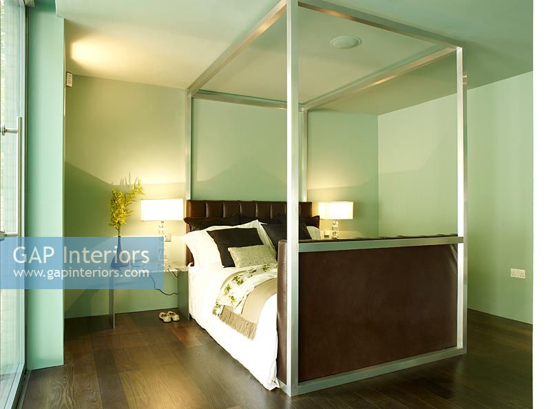 Contemporary bedroom with four poster bed
