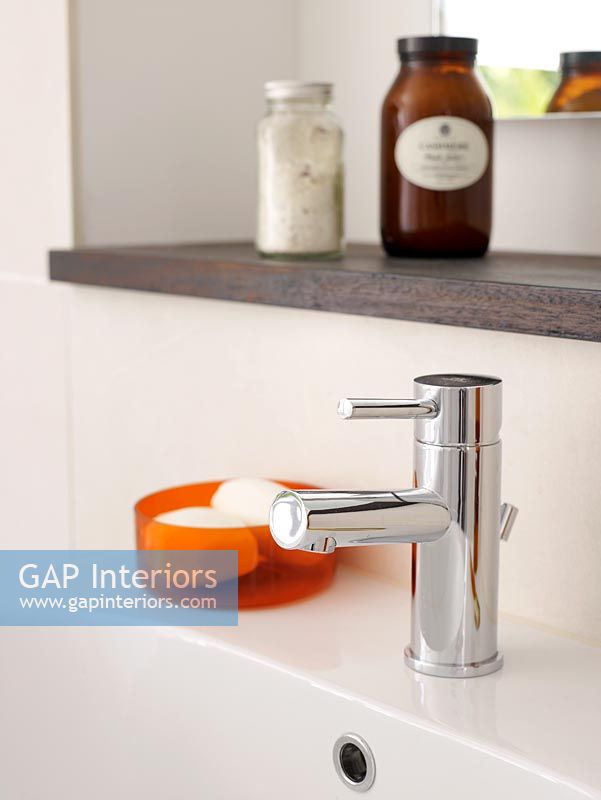 Detail of taps on modern bathroom sink