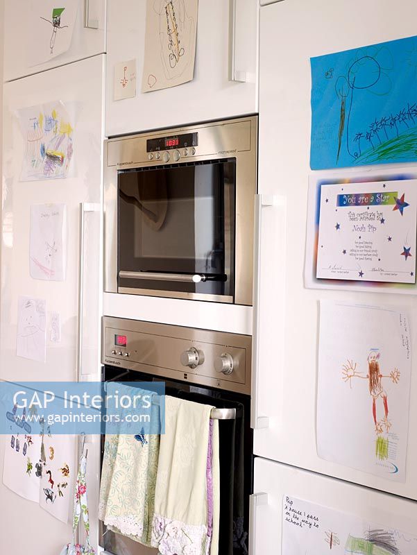 Integrated oven with childrens drawings on display