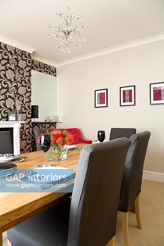 Modern dining room with wallpapered feature wall