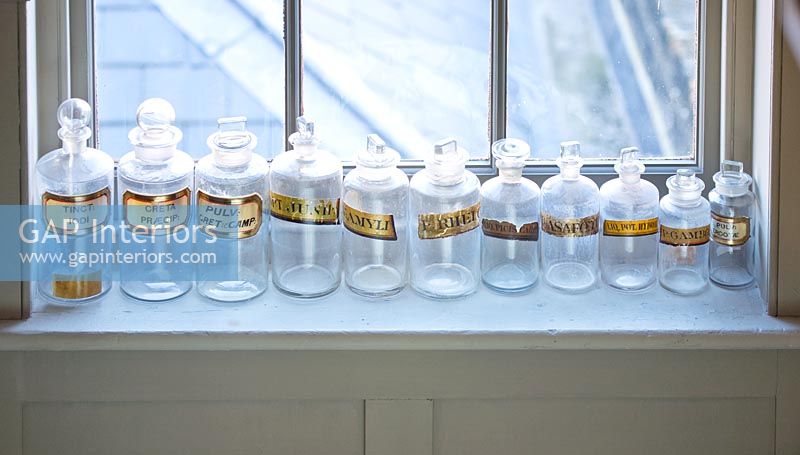 Bottles on display on windowsill 