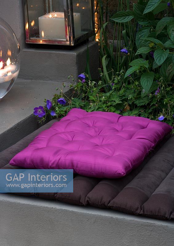 Purple cushion in garden 