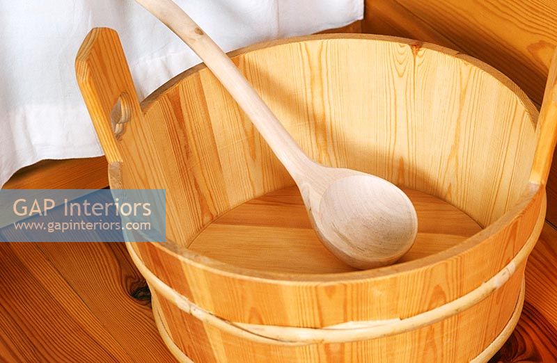 Close-up of wooden bucket with spoon