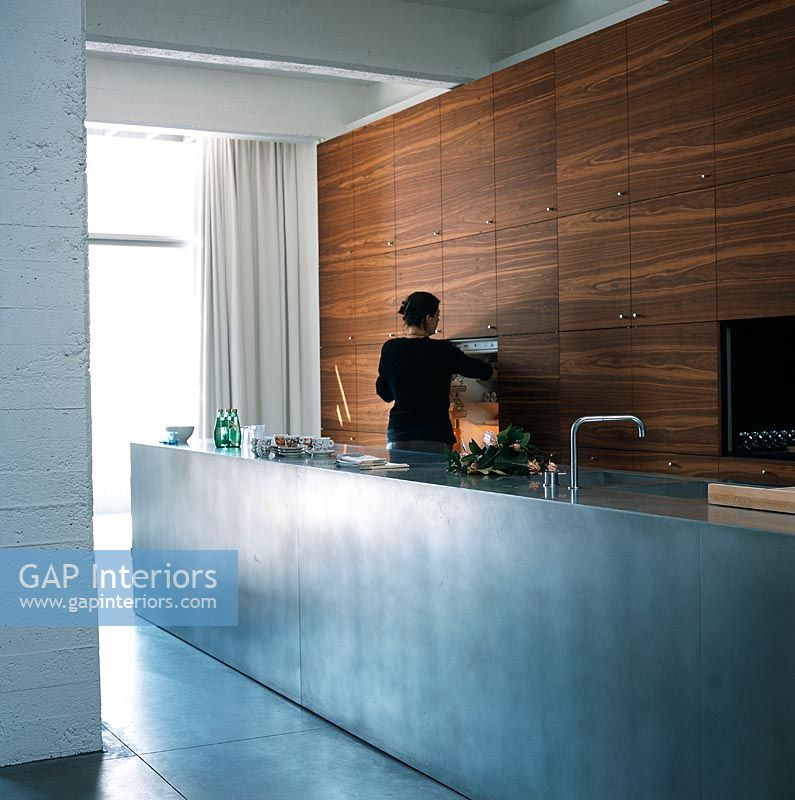 Person in a modern kitchen